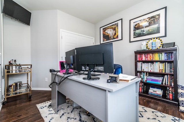 office with dark hardwood / wood-style flooring