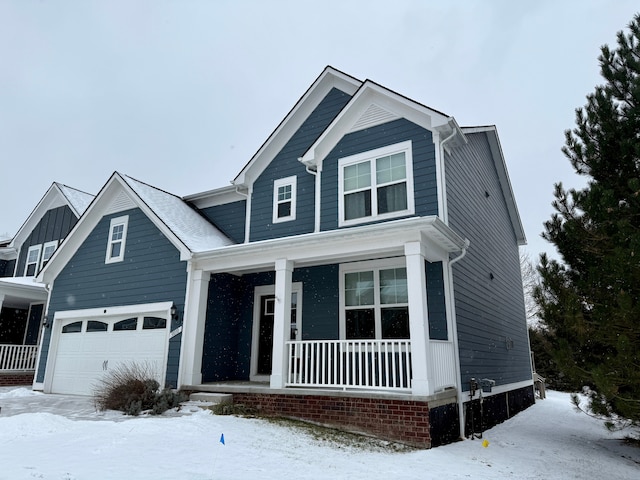 view of front of house with a porch and a garage