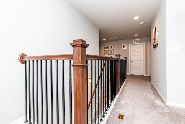 stairs featuring carpet flooring