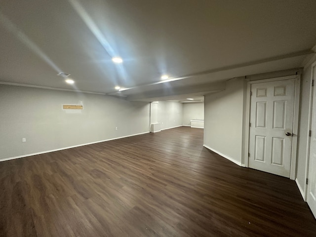 basement featuring dark wood-type flooring