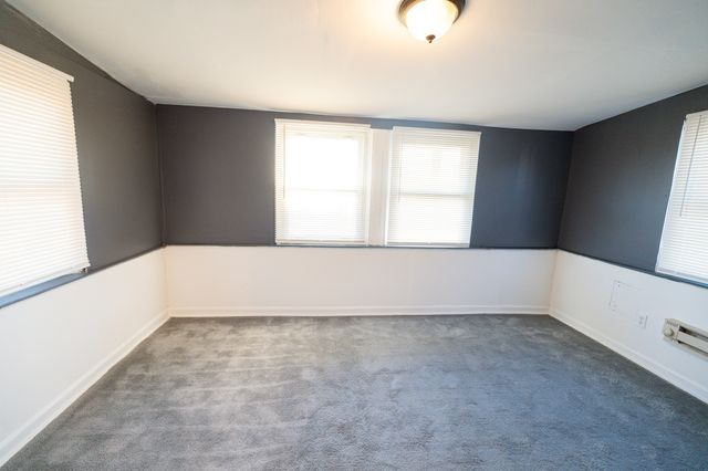 empty room with carpet flooring