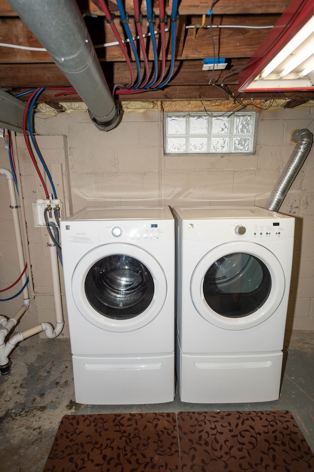 clothes washing area featuring washing machine and clothes dryer