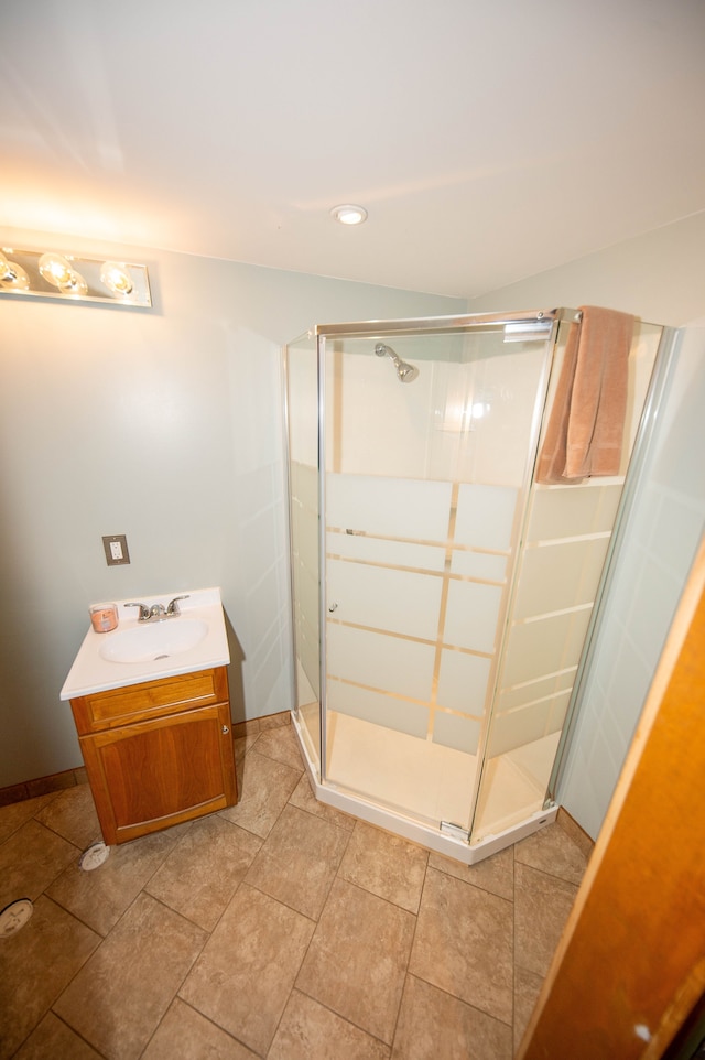 bathroom with an enclosed shower and vanity