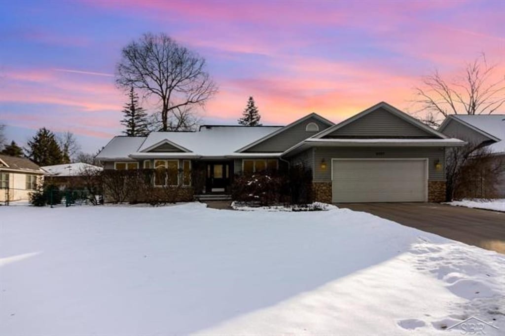 ranch-style home with a garage