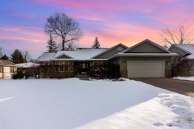 ranch-style home with a garage