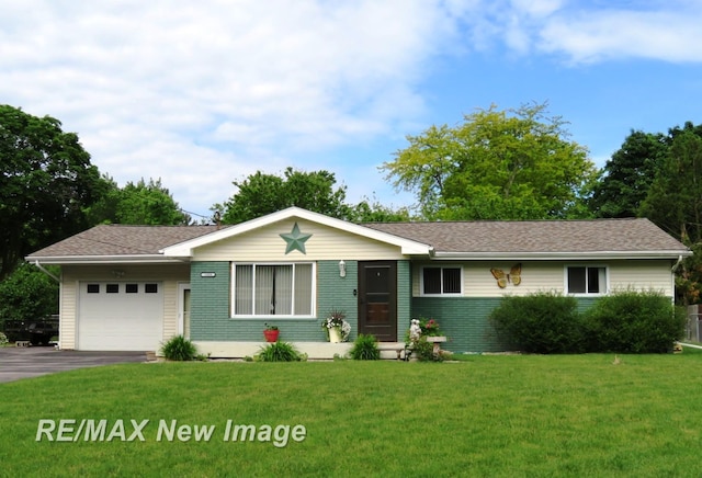 single story home with a garage and a front lawn