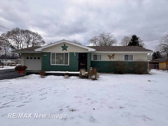 single story home featuring a garage