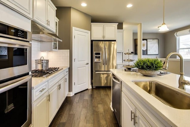 kitchen featuring sink, stainless steel appliances, and white cabinets