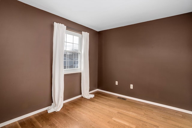 spare room with light wood-type flooring