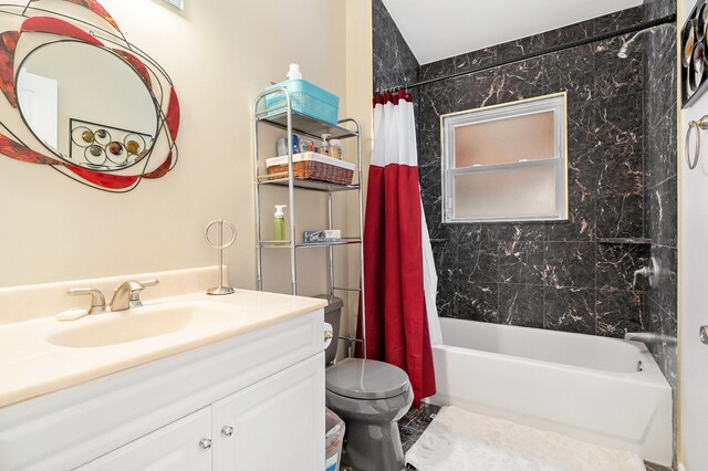 full bathroom featuring vanity, toilet, and shower / tub combo