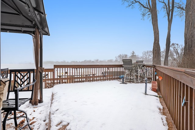 view of snow covered deck