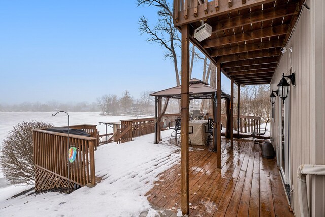 snow covered deck with a gazebo and an AC wall unit