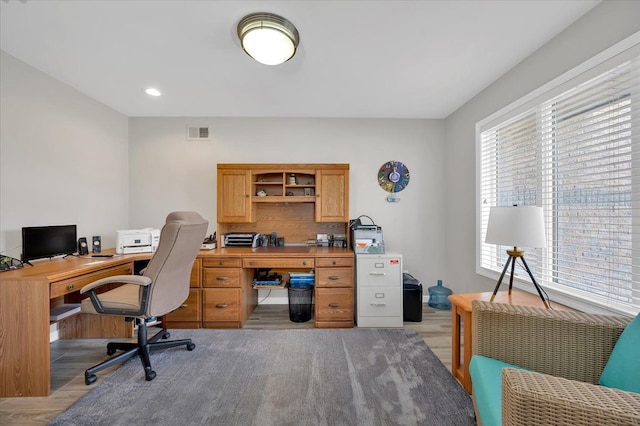 office space featuring light wood finished floors, visible vents, and recessed lighting