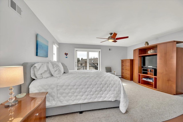 bedroom with visible vents, carpet floors, and a ceiling fan