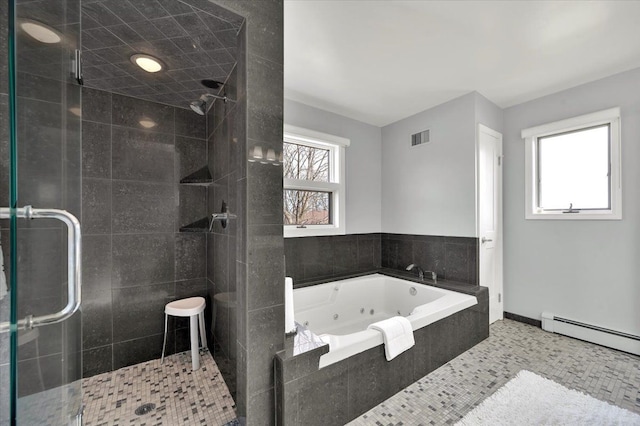 bathroom with a wealth of natural light, a jetted tub, and a stall shower