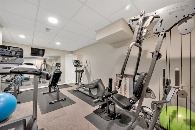 exercise room with visible vents, recessed lighting, and a paneled ceiling