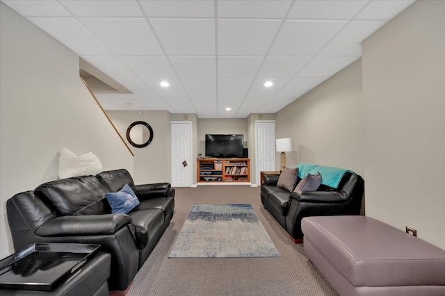 carpeted living room with recessed lighting and a paneled ceiling