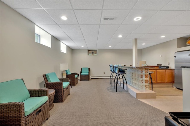 sitting room featuring visible vents, a drop ceiling, light colored carpet, recessed lighting, and a bar