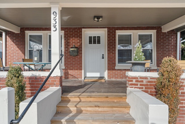 property entrance featuring covered porch