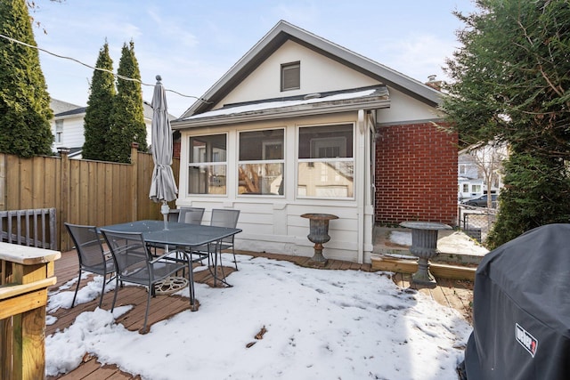 exterior space featuring a deck and a sunroom