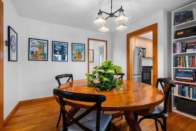 dining area featuring wood-type flooring