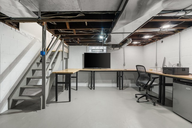 basement featuring fridge