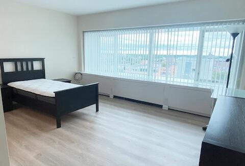 bedroom with light wood-type flooring