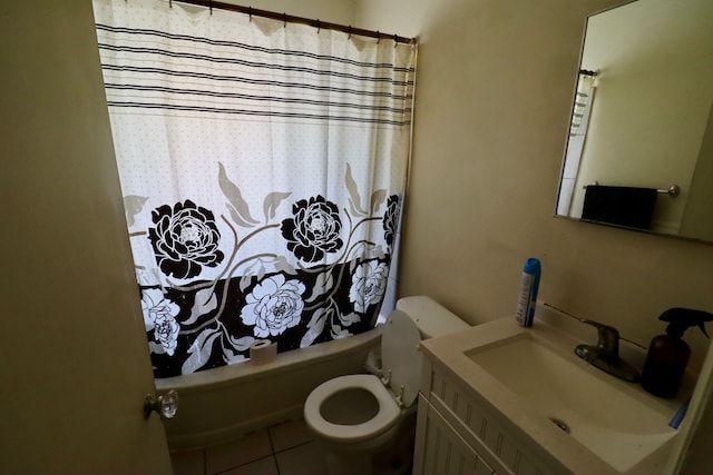 full bathroom featuring tile patterned flooring, shower / tub combo, vanity, and toilet