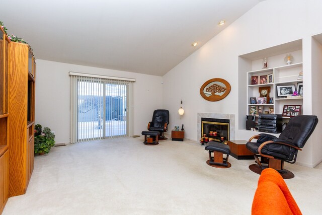 sitting room featuring light colored carpet, high vaulted ceiling, and built in features