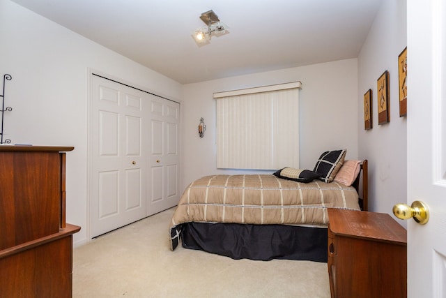 carpeted bedroom featuring a closet