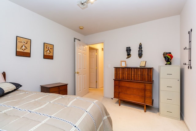 bedroom featuring light colored carpet