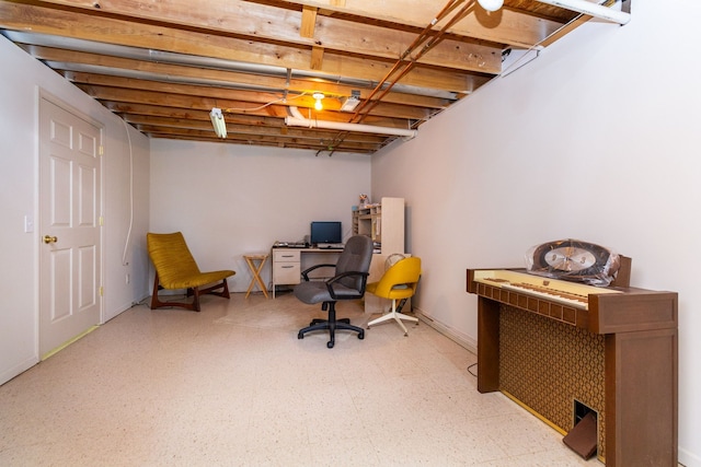 finished basement featuring light floors