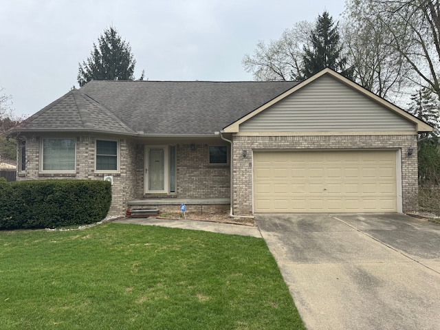 ranch-style house featuring driveway, a shingled roof, a front yard, brick siding, and a garage