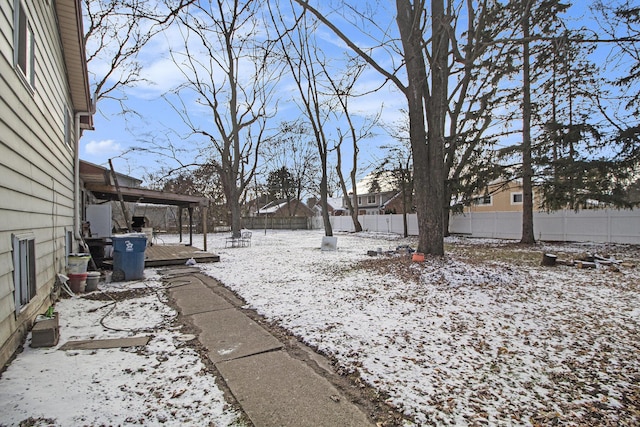 view of yard layered in snow