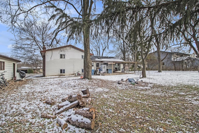 view of snow covered house