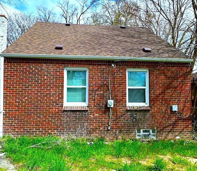 19307 Mansfield St, Detroit, MI 48235 - view of side of home featuring brick siding and a shingled roof