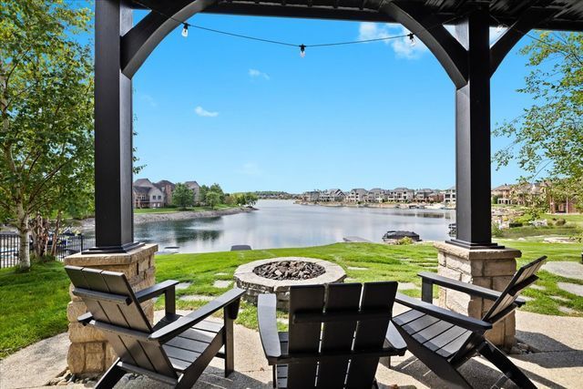 view of patio / terrace featuring a water view and an outdoor fire pit