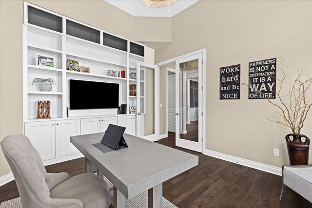 office featuring dark hardwood / wood-style floors and french doors