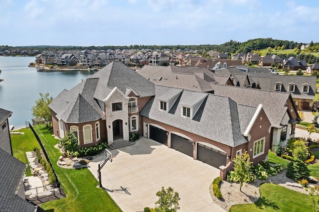 drone / aerial view featuring a water view