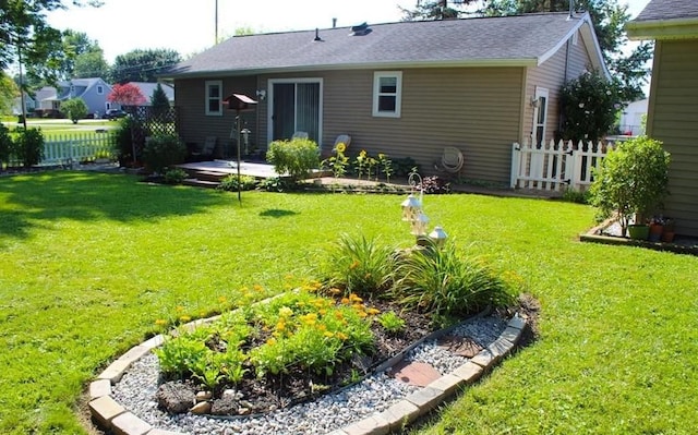 back of property featuring a yard and a patio area