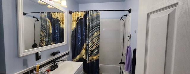 bathroom with vanity and shower / bath combo with shower curtain