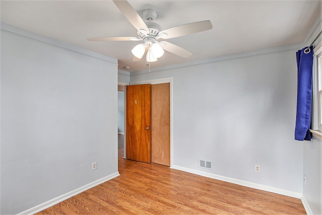 empty room featuring light hardwood / wood-style flooring and ceiling fan