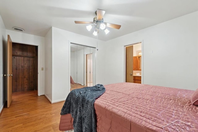 bedroom with light hardwood / wood-style flooring, a closet, and ceiling fan