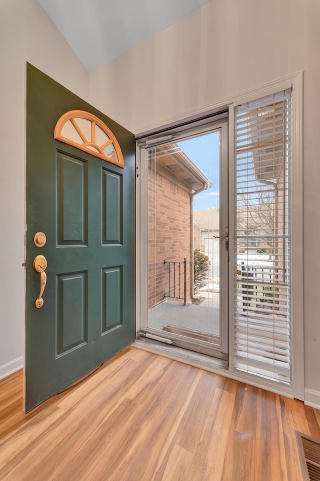 foyer entrance featuring hardwood / wood-style flooring