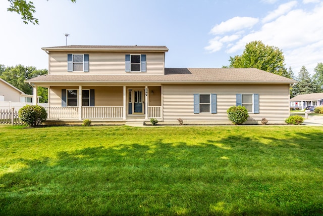 view of front of house featuring a front yard and covered porch