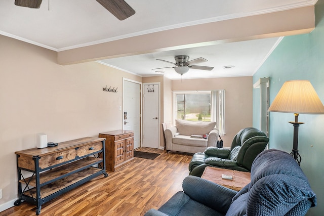 living room with crown molding, ceiling fan, and hardwood / wood-style floors