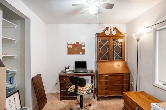 carpeted office with ceiling fan