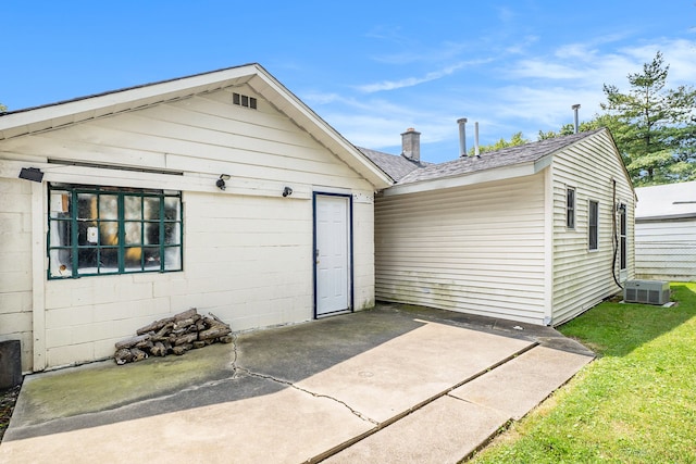 exterior space featuring cooling unit and a patio area