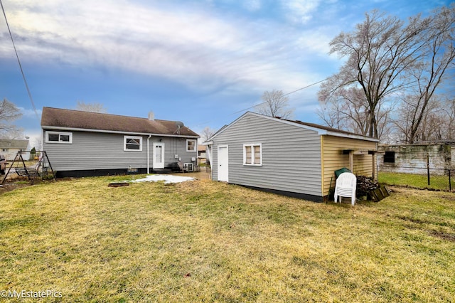 rear view of house with a lawn