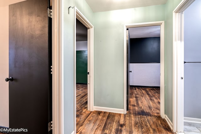 hall with dark hardwood / wood-style floors